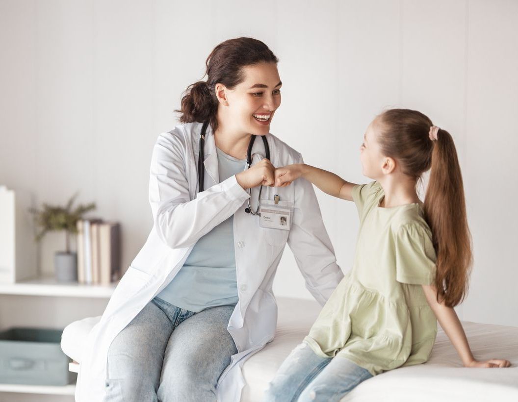Girl patient listening to a doctor in medical office.